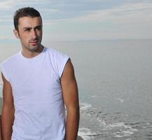 young man at beach photo