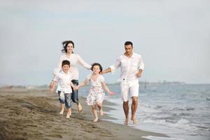 happy young family have fun on beach photo