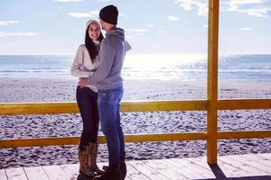 Couple chating and having fun at beach bar photo