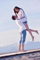 young couple  on beach have fun photo