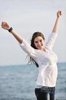 young woman enjoy on beach photo