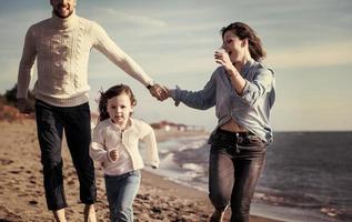 Young family enjoying vecation during autumn photo