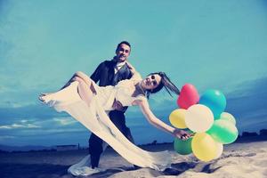 romantic beach wedding at sunset photo