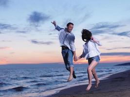 young couple  on beach have fun photo