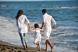 happy young  family have fun on beach photo