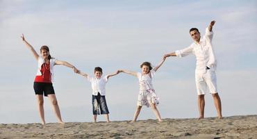 happy young family have fun on beach photo