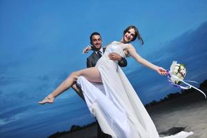 romantic beach wedding at sunset photo