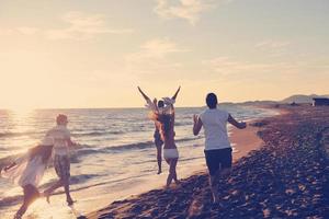 people group running on the beach photo