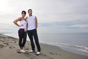 happy young couple have fun at beautiful beach photo