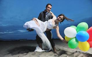 romantic beach wedding at sunset photo