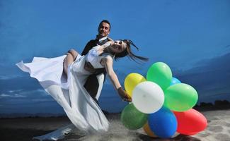 romantic beach wedding at sunset photo