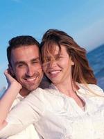 young couple  on beach have fun photo