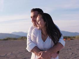 young couple  on beach have fun photo