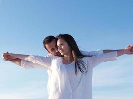 young couple  on beach have fun photo