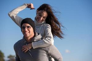 couple having fun at beach during autumn photo