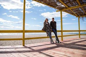 Couple chating and having fun at beach bar photo