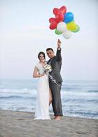 romantic beach wedding at sunset photo