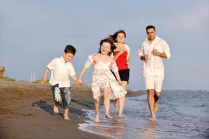 happy young family have fun on beach photo