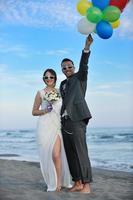 romantic beach wedding at sunset photo