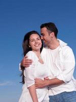 young couple  on beach have fun photo