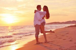 young couple  on beach have fun photo