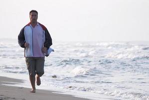 Runner on beach photo