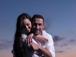 young couple  on beach have fun photo