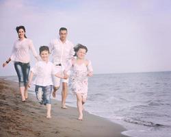 happy young family have fun on beach photo