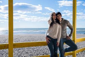 Couple chating and having fun at beach bar photo