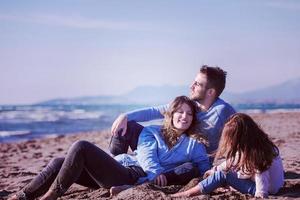 Young family enjoying vecation during autumn photo