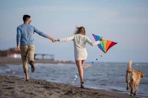 happy couple enjoying time together at beach photo