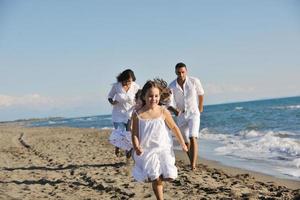 happy young  family have fun on beach photo