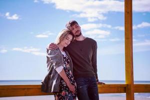 Couple chating and having fun at beach bar photo