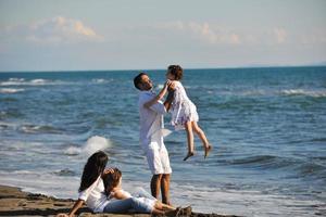 happy young  family have fun on beach photo