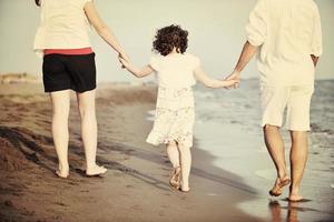 happy young family have fun on beach photo