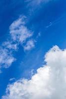 Regular spring clouds on blue sky at daylight in continental europe. Close shot wit telehoto lens and polarizing filter. photo