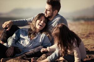 Young family enjoying vecation during autumn photo