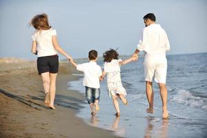 happy young family have fun on beach photo