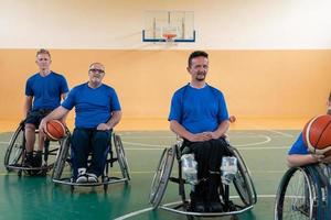 photo of the basketball team of war invalids with professional sports equipment for people with disabilities on the basketball court