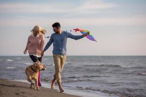 happy couple enjoying time together at beach photo