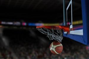 basketball ball and net on black background photo