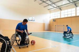 a handicapped basketball player prepares for a match while sitting in a wheelchair.preparations for a professional basketball match. the concept of disability sport photo