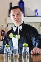 pro barman prepare coctail drink on party photo