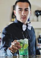 pro barman prepare coctail drink on party photo