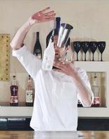 pro barman prepare coctail drink on party photo