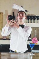 pro barman prepare coctail drink on party photo