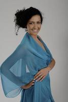 elegant woman in fashionable dress posing in the studio photo