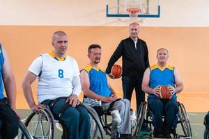 a photo of basketball teams with disabilities with the selector in the big hall before the start of the basketball game