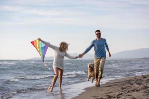 happy couple enjoying time together at beach photo