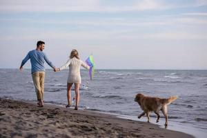 happy couple enjoying time together at beach photo